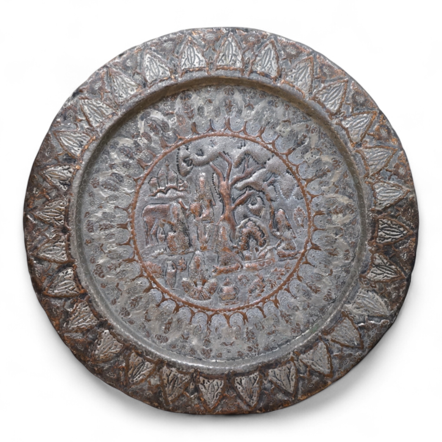 A circular Persian tinned copper embossed tray 88cm diameter